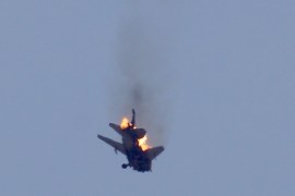 An aircraft belonging to Syrian regime forces bursts into flames after it was hit by Syrian opposition forces when it was launching airstrikes on opposition-controlled areas in Daraa, Syria [Getty]