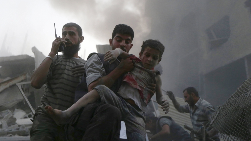  Rescuers managed to pull several people alive from the rubble in Douma [Reuters] 