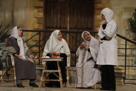 Palestinian women perform in a play on stage in Gaza City in 2012 [AFP]