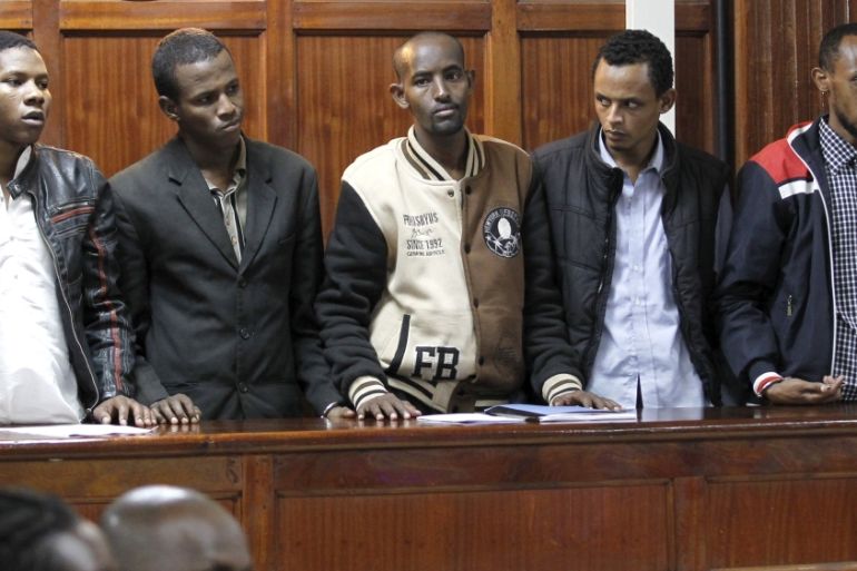 Suspects stands inside the dock at the Milimani Law Courts in Kenya''s capital Nairobi