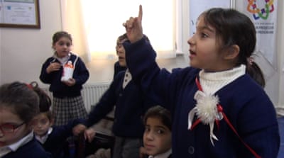 There are an estimated 900,000 Syrian children living in Turkey [Hassan Ghani/Al Jazeera]