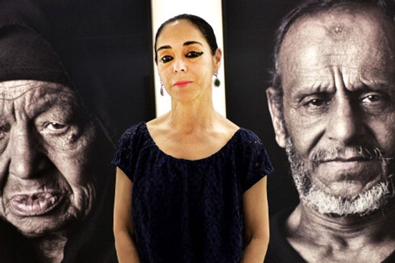 Shirin Neshat poses at the Dirimart Gallery during the presentation of ''The Book of Kings'' series in Istanbul in 2013 [Getty]