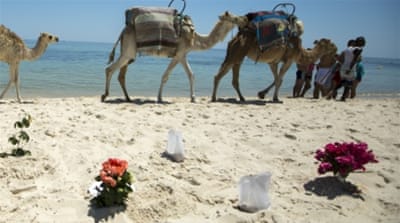 Bouquets of flowers are laid at the beachside of the Imperial Marhaba resort [Reuters]