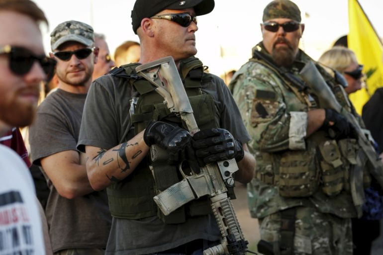 Men carrying rifles attend "Freedom of Speech Rally Round II" across from Islamic Community Center in Phoenix