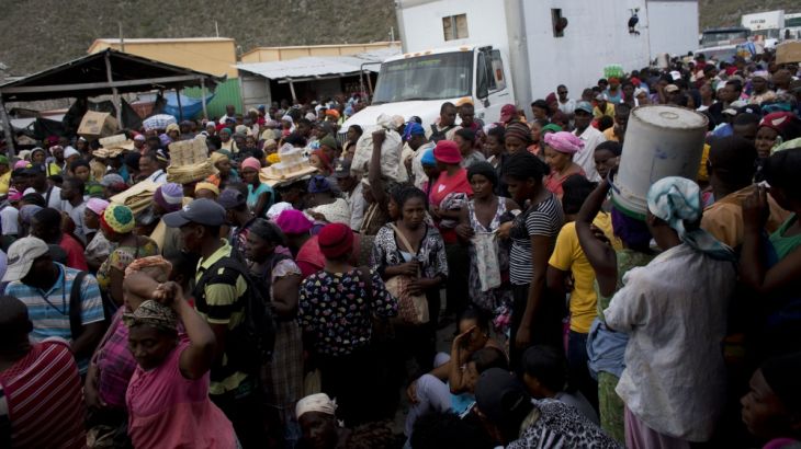 Haitians wait for the opening of the border between Jimani, Dominican Republic, and Malpasse, Haiti