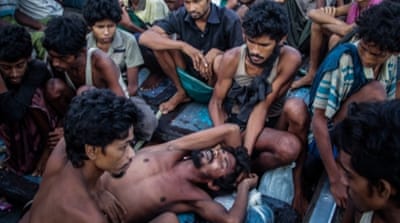 Rohingya migrants resting on a boat off the coast near Indonesia's Aceh province before being rescued [AFP]