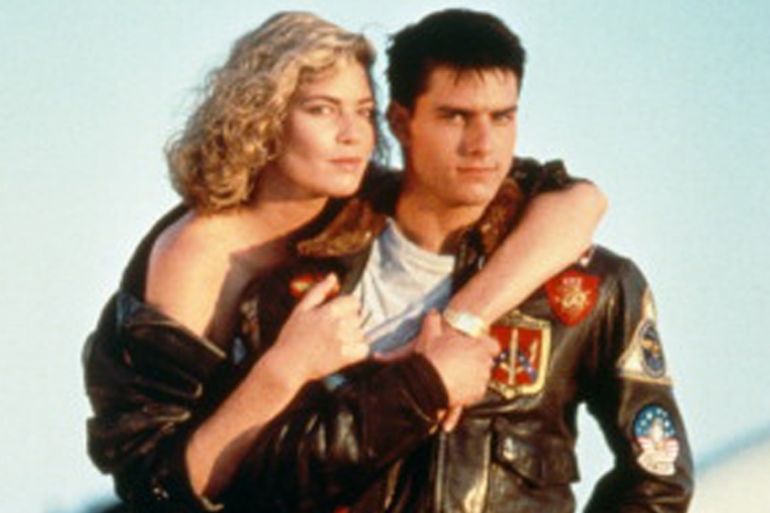 American actors Tom Cruise, and Kelly McGillis in a promotional portrait for Top Gun, directed by Tony Scott, 1986 [Getty]