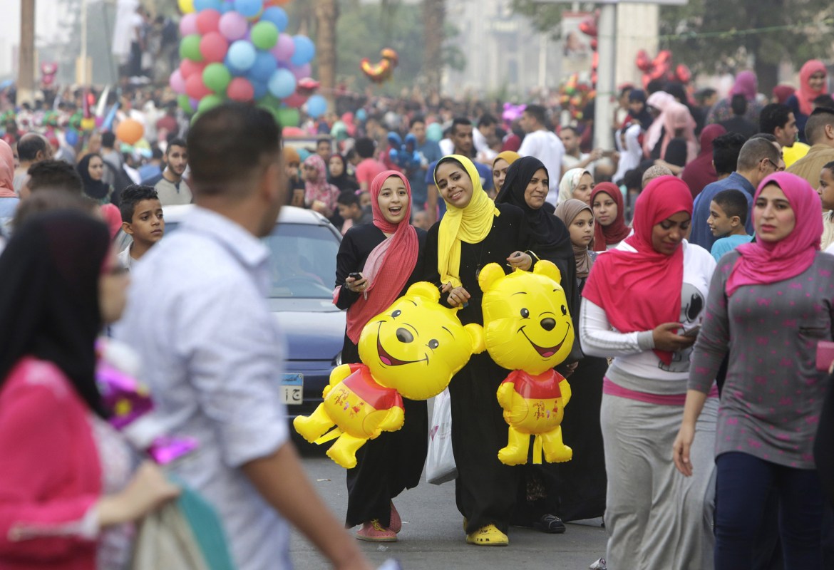 Egyptians celebrate Eid al-Fitr, marking the end of the Muslim holy month of Ramadan in Cairo, Egypt, Friday, July 17, 2015. (AP Photo/Amr Nabil)