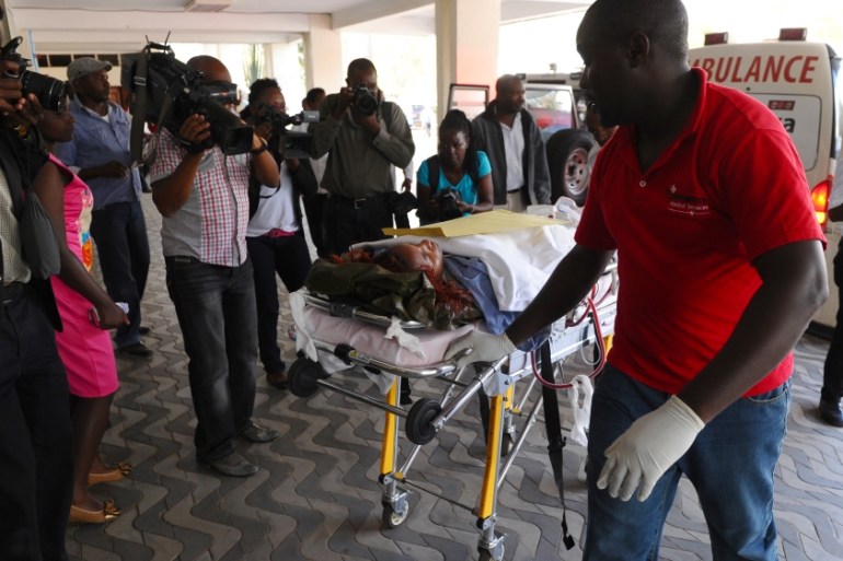 Medics help an injured person at Kenyatta National Hospital in Nairobi, Kenya
