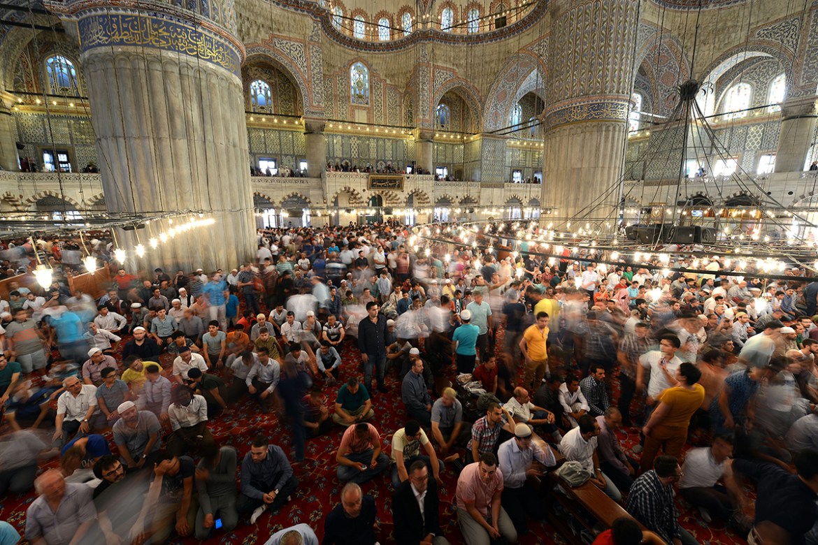 Turkish Muslims prepare to pray inside the Blue Mosque in Istanbul