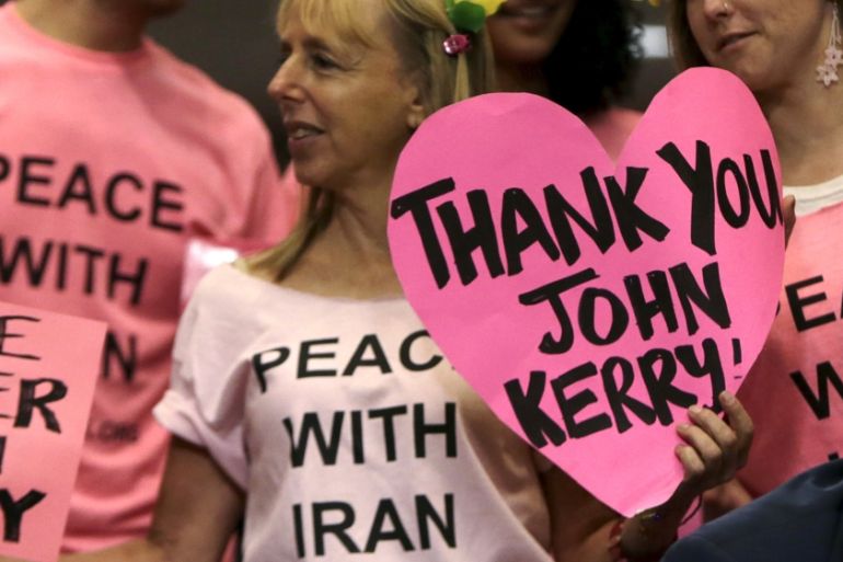 Code Pink protesters congratulate Secretary of State Kerry before Senate Foreign Relations Committee in Washington