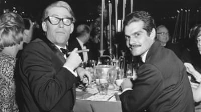 Peter O'Toole and Omar Sharif at a dinner party following the premiere of Lawrence of Arabia in Hollywood [AP]