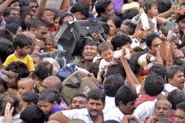 Devotees crowd to attend the Maha Pushkaralu on the banks of river Godavari at Rajahmundry
