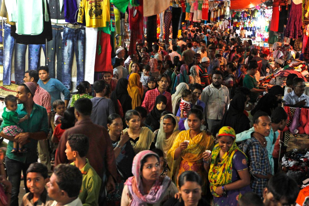 Indian Muslims shop at a market place late in the evening for Eid al-Fitr, in Ahmadabad, India