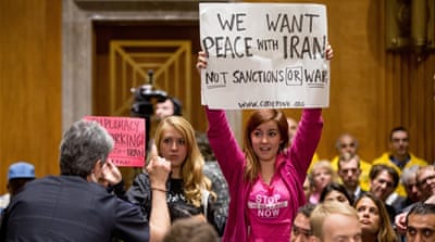 CodePink protest during a Senate Foreign Relations Committee debate on the Iran Nuclear Agreement Review Act [AP]