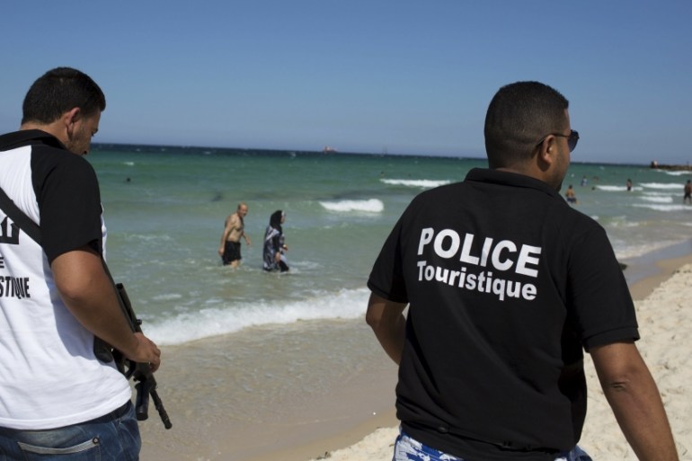 Tourist police officers patrol the beach in Sousse,