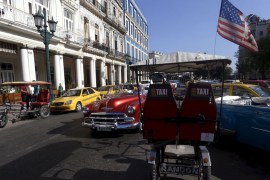 TRICYCLE IN HAVANA WITH THE US FLAG