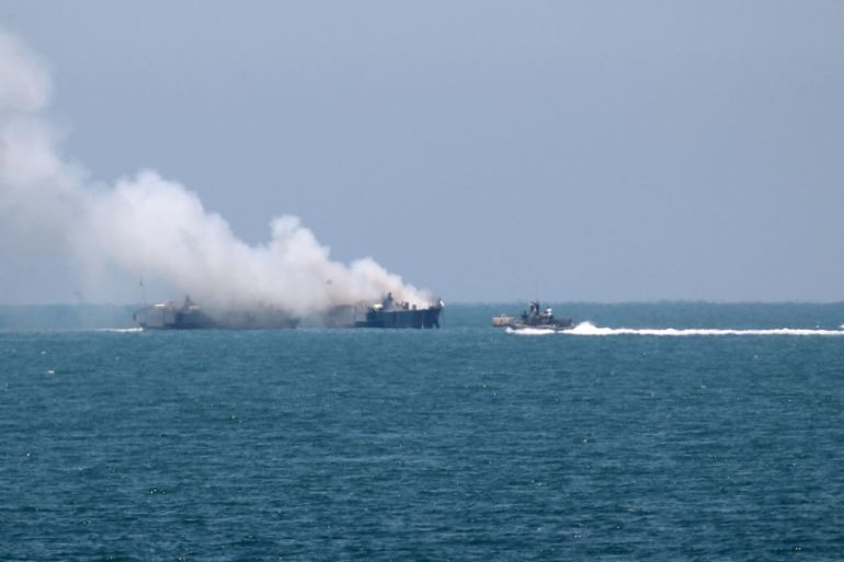 Smokes rises from an Egyptian coastguard vessel on the coast of northern Sinai, as seen from the border of southern Gaza Strip with Egypt
