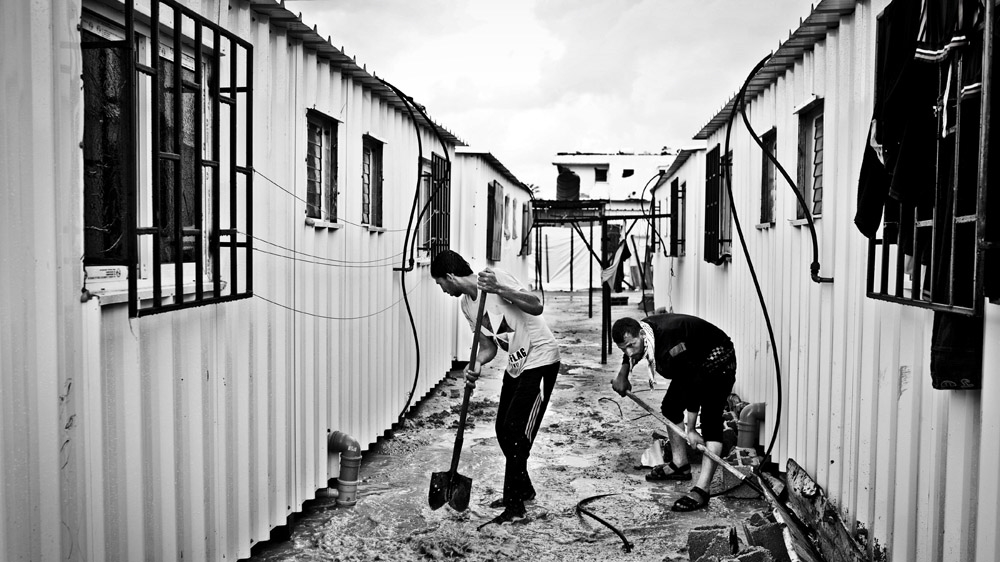 When it rains, the donated container homes flood [Virginie Nguyen Hoang/Hanslucas/Collectif Huma] 