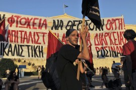 Anti Austerity protesters demonstrate in front of the Greek Parliament