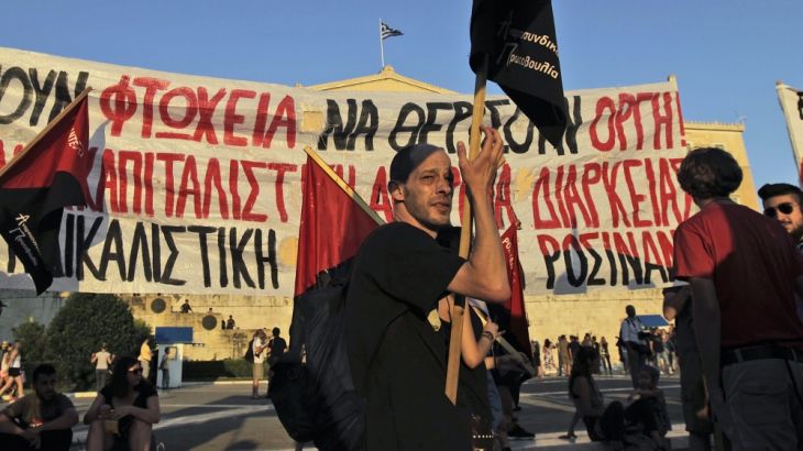 Anti Austerity protesters demonstrate in front of the Greek Parliament