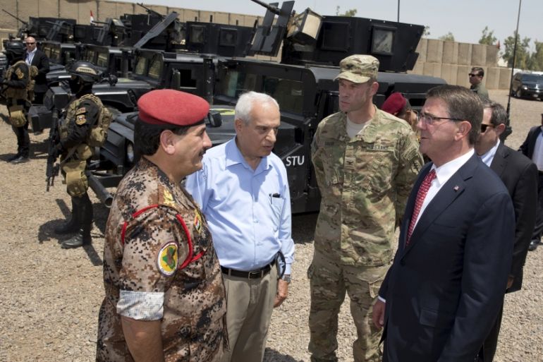 U.S. Defense Secretary Ash Carter is greeted by Iraqi Major General Falah al Mohamedawi (L) at a training exercise at the Iraqi Counter Terrorism Service Academy in Baghdad