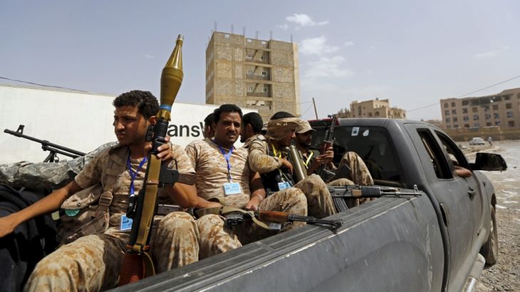 Houthi fighters ride on the back of a patrol truck in Yemen''s capital Sanaa