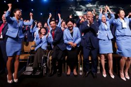 Members of the Beijing delegation celebrate after Beijing was awarded the 2022 Winter Olympic Games, defeating Almaty in the final round of voting, during the 128th IOC session in Kuala Lumpur