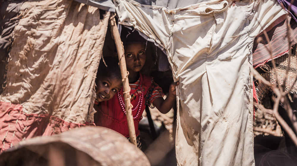 Pastoralists will often leave women, children and the elderly at their home base as young boys and men travel with livestock. Drought typically pushes the whole family to pack up and travel, sometimes extraordinary distances. [Adrian Leversby/Awr Productions/Al Jazeera]