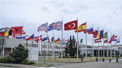 Member countries' flags are seen in front of the NATO headquarters in Brussels, Belgium [Getty]