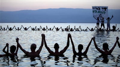 Israelis participate in a special project to raise awareness of the shrinking Dead Sea [EPA]