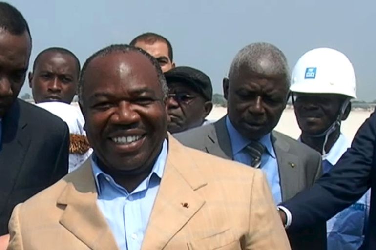 Gabonese President Ali Bongo Ondimba shakes the hand of soccer star Lionel Messi at the construction site of a new soccer stadium in Port-Gentil