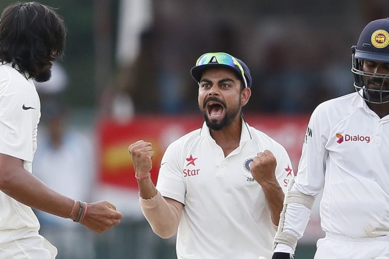 India''s Sharma celebrates with captain Kohli after taking the wicket of Sri Lanka''s Tharanga during the fourth day of their third and final test cricket match in Colombo