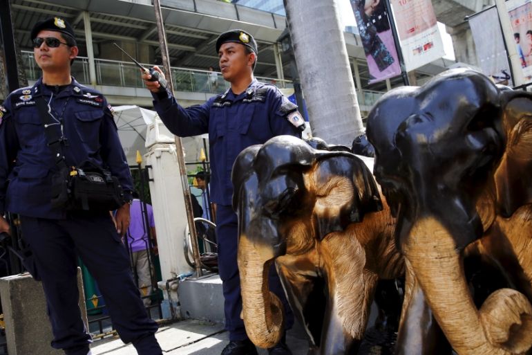 Thai police stand guard at Erawan Shrine, the site of the recent bomb blast, in Bangkok