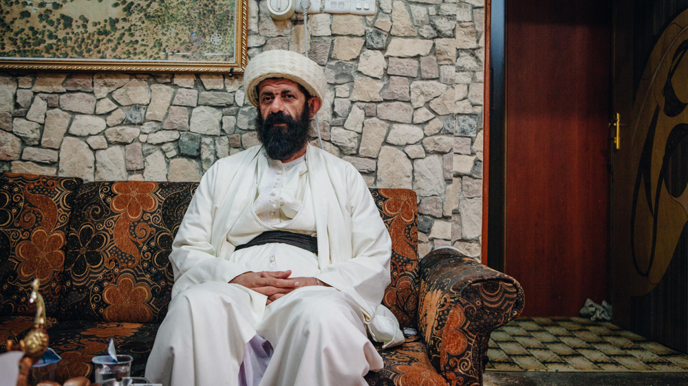 Baba Chawesh, a senior Yazidi religious figure, is one of seven priests who reside in Lalish [Andrea DiCenzo/Al Jazeera]