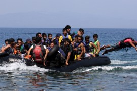 A dinghy overcrowded with Afghan immigrants approaches the coast of the Greek island of Lesbos after crossing from Turkey to Greece