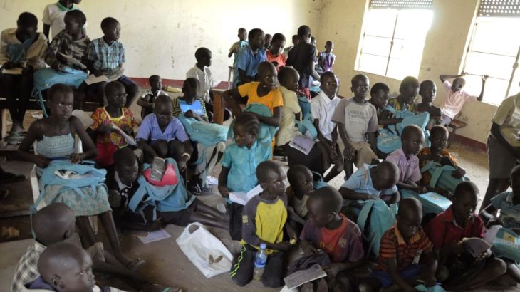 Children sit inside a looted classroom at the Doronj Sown secondary school after renewed conflict in Bor, Jonglei state