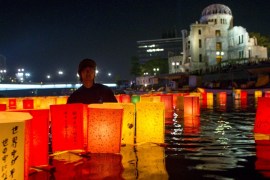 Paper lanterns float on Motoyasu river after being released in remembrance of atomic bomb victims on the 70th anniversary of bombing of Hiroshima