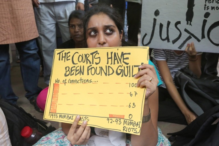 Indian social activists from varous organiszatons hold placards during a protest against capital punihsment