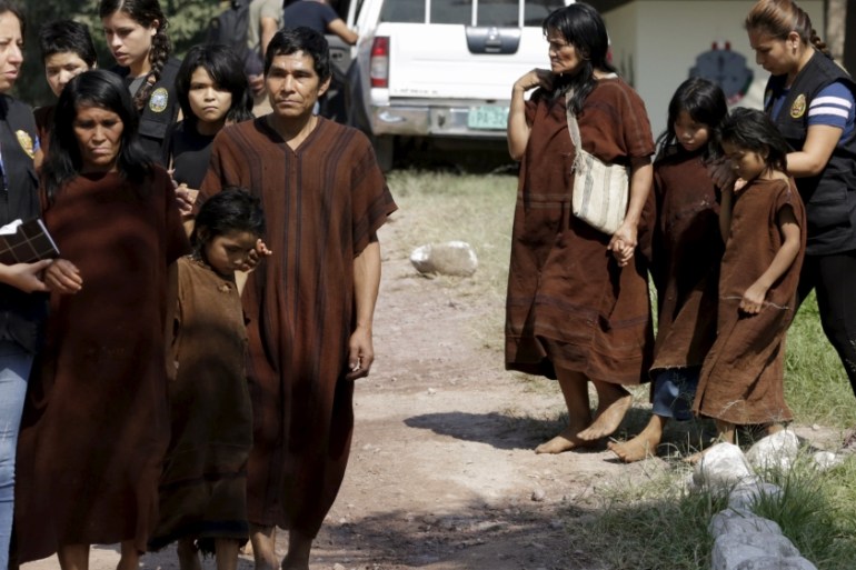 Peruvian anti-terrorist forces escort a group of people rescued from Shining Path rebels, at Mazamari military base, in the Amazon province of Satipo