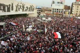 People shout slogans during a demonstration at Tahrir Square in central Baghdad
