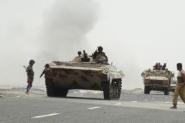 Southern Resistance fighters gather on a road leading to Yemen''s Houthi-held southern province of Abyan