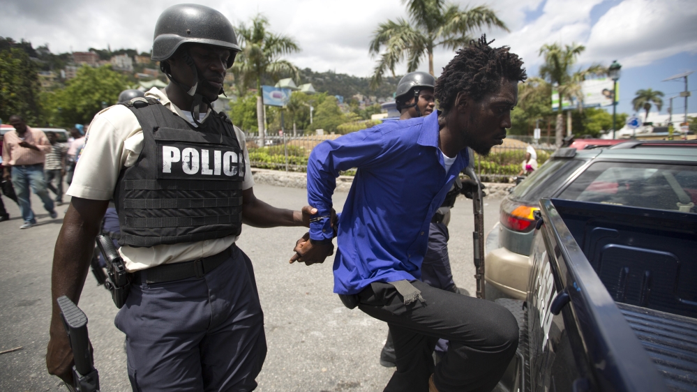 A number of arrests were made in Haiti's elections on Sunday, but observers believe the polls went reasonably well [AP]