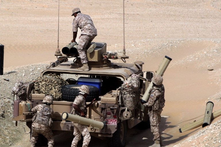 UAE soldiers load their military vehicle