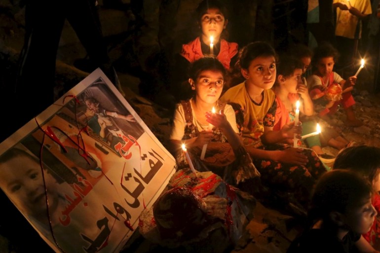 Palestinian children light candles during a rally to remember 18-month-old Palestinian baby Ali Dawabsheh who was killed after his family''s house was set on fire in a suspected attack by Jewish extrem