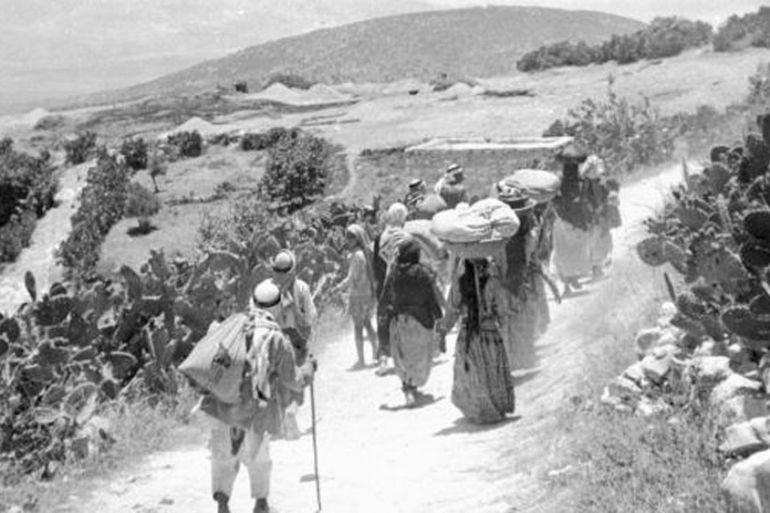 Palestinian refugees returning to their village after surrendering during the 1948 Arab war against the proclamation of the Israeli State [AFP]