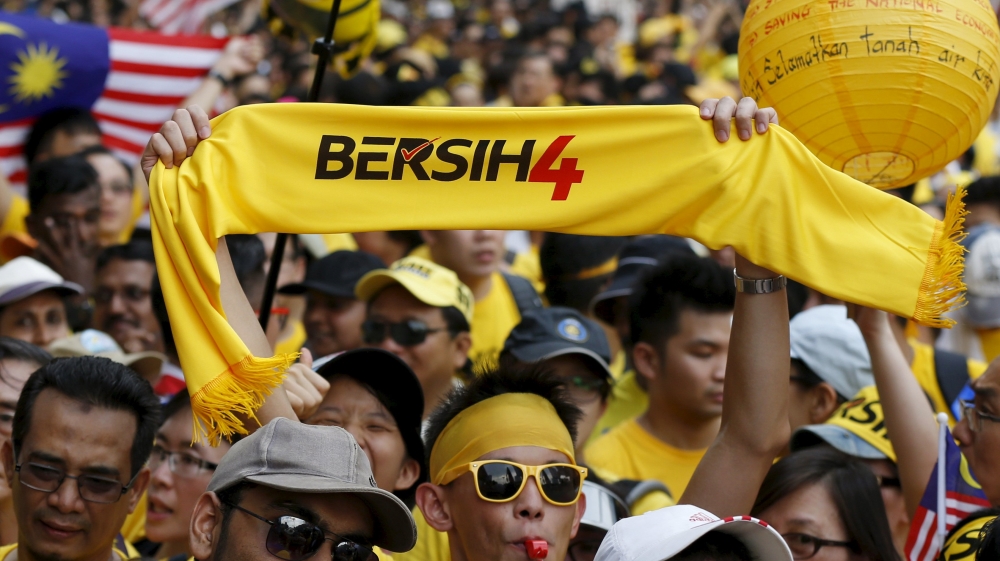Protesters in yellow Bersih T-shirts and headbands converged at five locations and were marching to areas surrounding the landmark Independence Square [Reuters]
