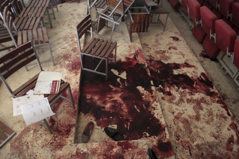 File photo of shoes in blood on the auditorium floor at the Army Public School, which was attacked by Taliban gunmen, in Peshawar