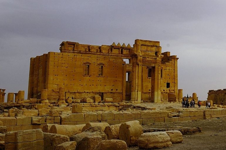 Tourists walk in the Temple of Bel at the historical city of Palmyra