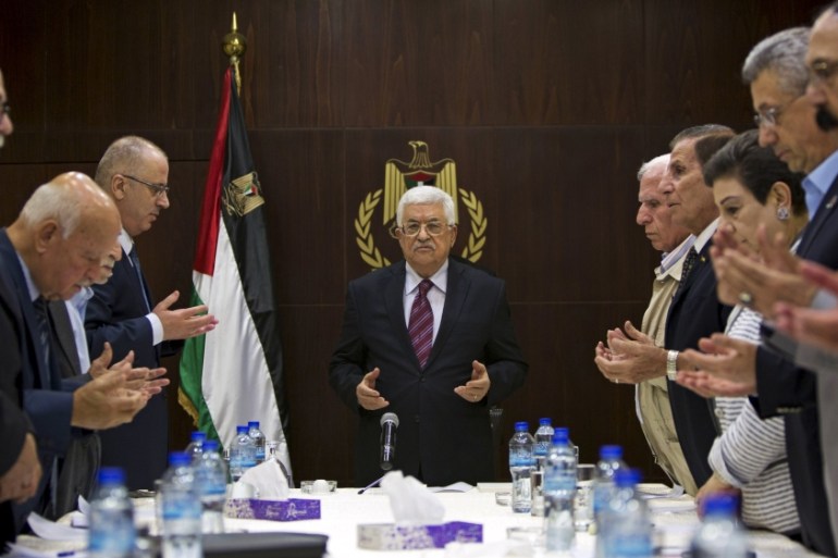 Palestinian President Mahmoud Abbas joins a reading of the Koran prior to a meeting of the Palestinian Liberation Organization (PLO) executive committee in the West Bank city of Ramallah [REUTERS]